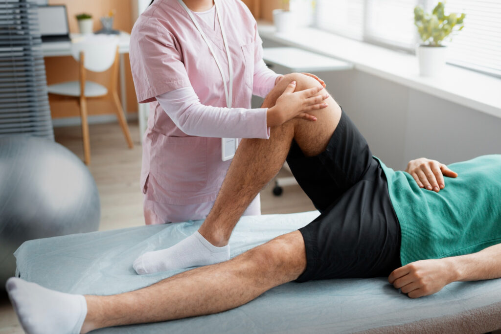 physio helping patient during rehabilitation