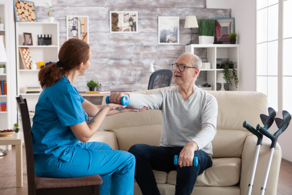 physiotherapy treatment in nursing home with senior man